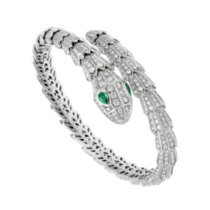 Serpenti 18 kt white gold bracelet set with pavé diamonds and two emerald eyes.